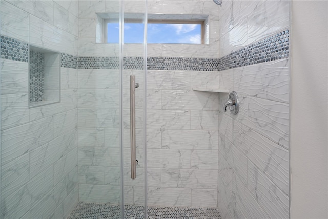 bathroom with a shower stall