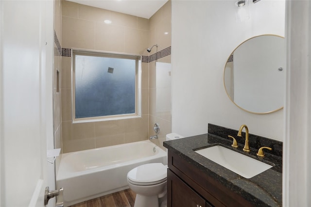 full bath with vanity, toilet, wood finished floors, and shower / bathtub combination