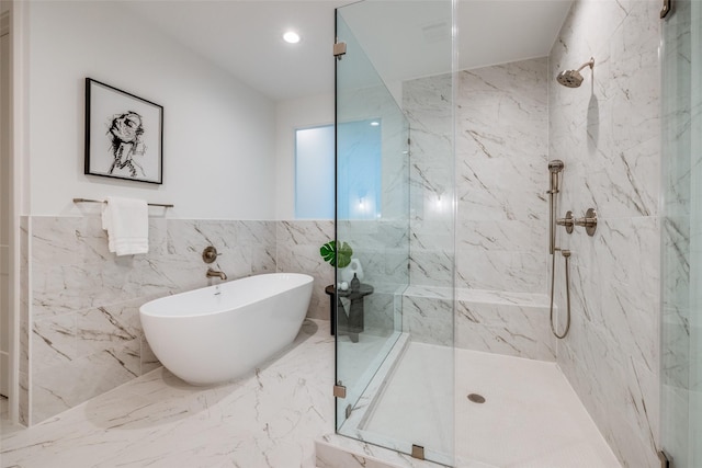 full bathroom featuring a marble finish shower, marble finish floor, and a freestanding tub