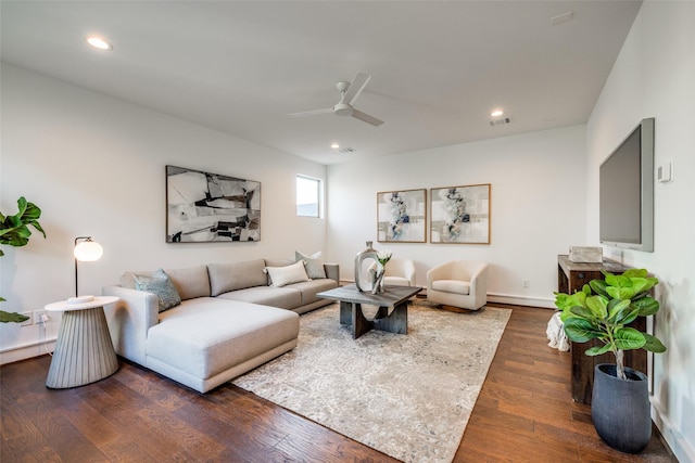 living room with visible vents, a ceiling fan, dark wood finished floors, recessed lighting, and a baseboard radiator