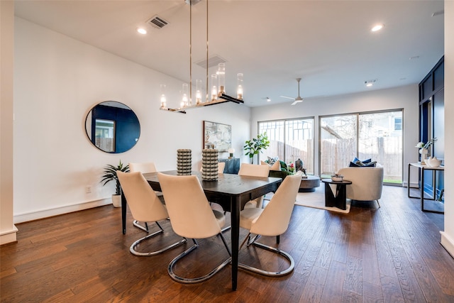 dining area featuring visible vents, baseboards, recessed lighting, an inviting chandelier, and dark wood-style flooring