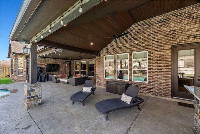 view of patio featuring a ceiling fan and outdoor lounge area