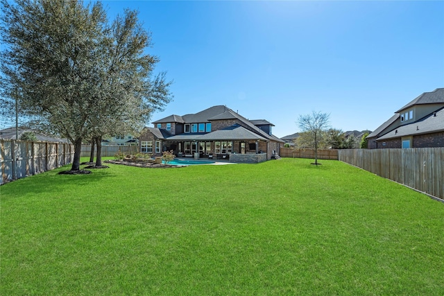 view of yard with a fenced in pool, a patio, and a fenced backyard