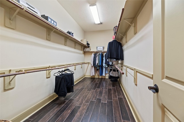 spacious closet with visible vents and wood finish floors