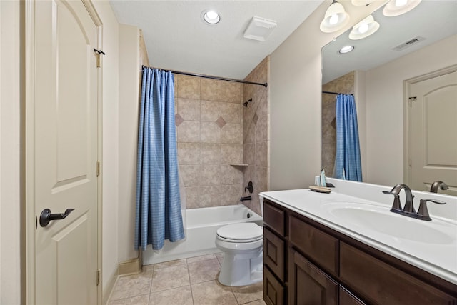 full bathroom featuring tile patterned floors, visible vents, toilet, and vanity