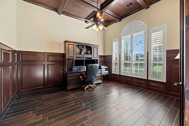 office space featuring beam ceiling, a decorative wall, coffered ceiling, and wood finish floors