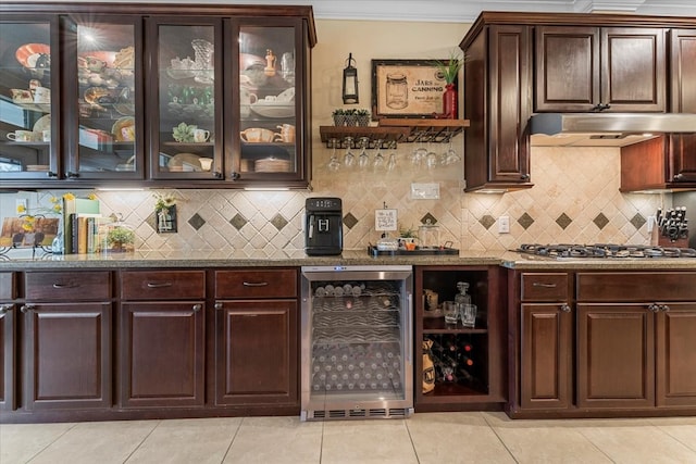 bar with stainless steel gas cooktop, ornamental molding, decorative backsplash, wine cooler, and under cabinet range hood