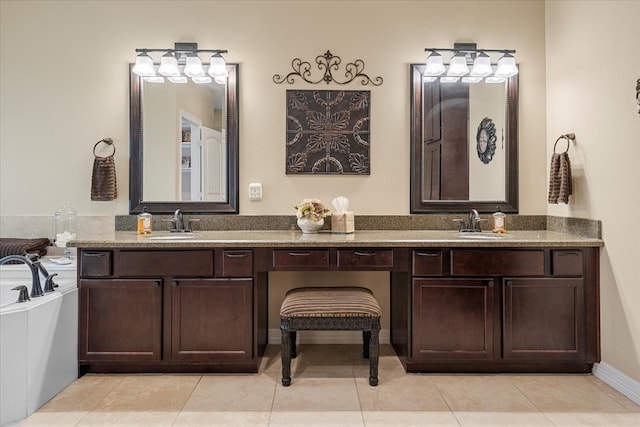 bathroom featuring tile patterned flooring, double vanity, a bathtub, and a sink