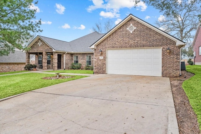 ranch-style house featuring a front yard, roof with shingles, an attached garage, concrete driveway, and brick siding