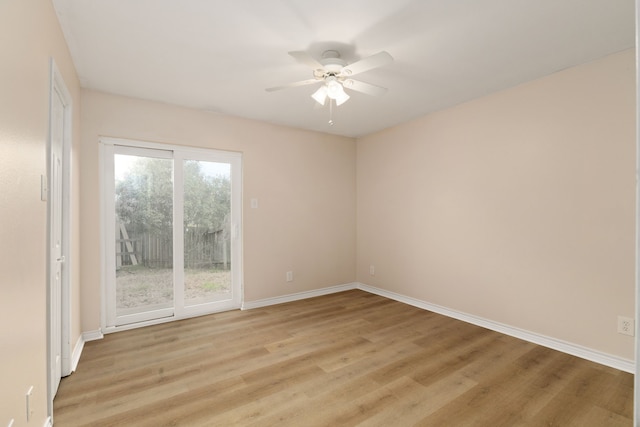 empty room with baseboards, light wood-type flooring, and ceiling fan