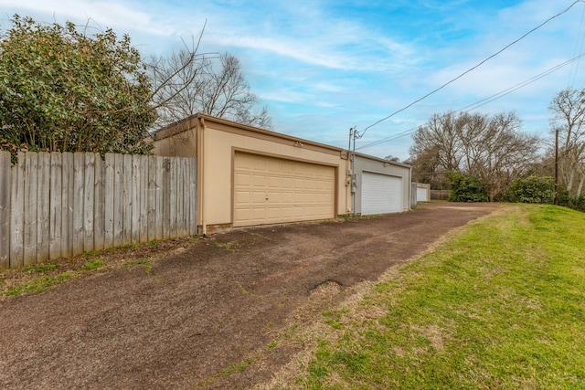 garage with fence