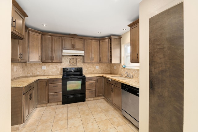 kitchen with under cabinet range hood, dishwasher, light tile patterned floors, black electric range oven, and a sink