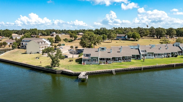 drone / aerial view with a residential view and a water view