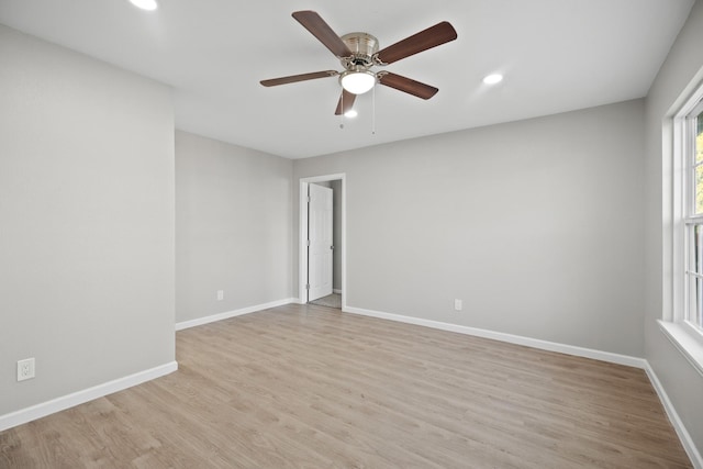 unfurnished room featuring recessed lighting, ceiling fan, baseboards, and light wood-style floors