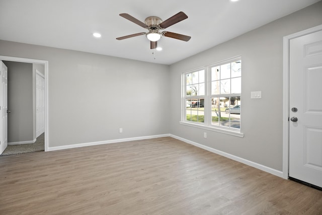 interior space featuring recessed lighting, baseboards, ceiling fan, and light wood finished floors