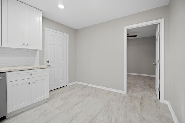 unfurnished dining area featuring recessed lighting and baseboards