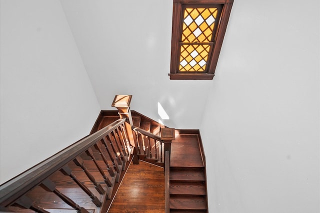 stairs with wood finished floors