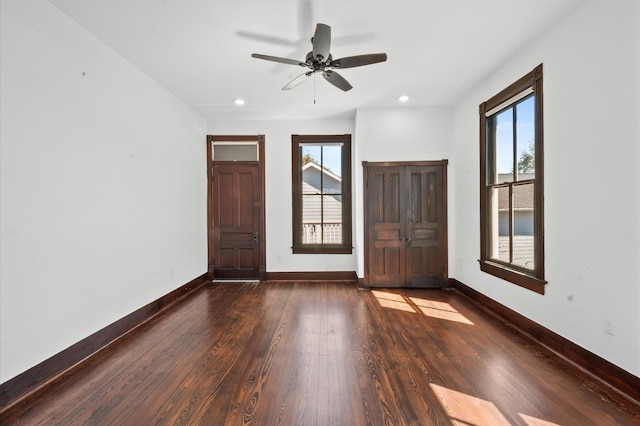 foyer featuring a wealth of natural light, baseboards, hardwood / wood-style floors, and recessed lighting