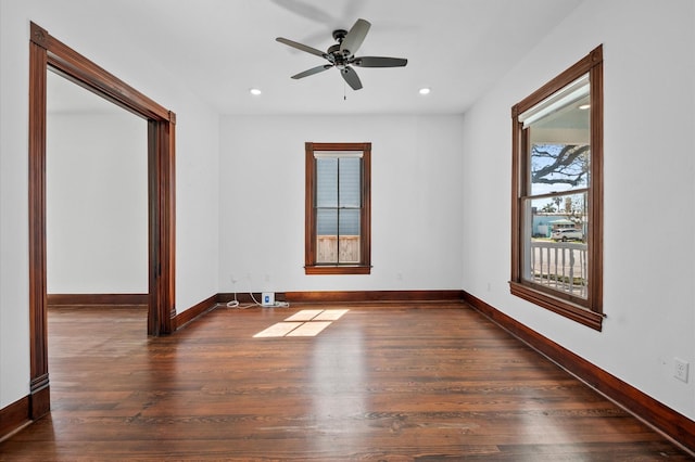 empty room featuring a ceiling fan, recessed lighting, wood finished floors, and baseboards