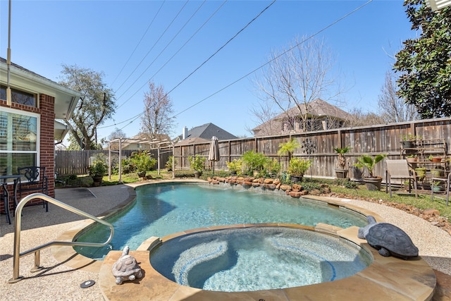 view of swimming pool with a patio, a fenced backyard, and a pool with connected hot tub