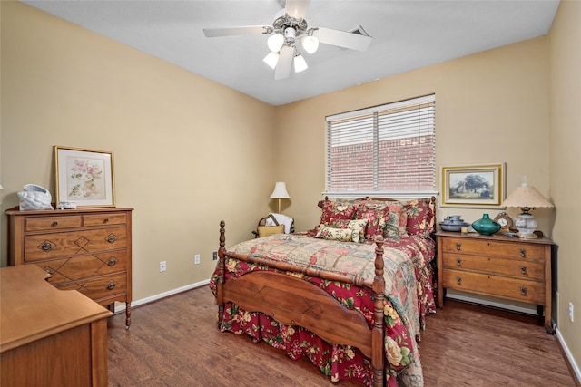 bedroom with wood finished floors, baseboards, and ceiling fan