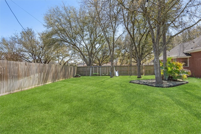 view of yard featuring a fenced backyard