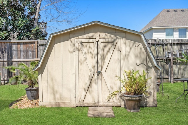 view of shed with fence