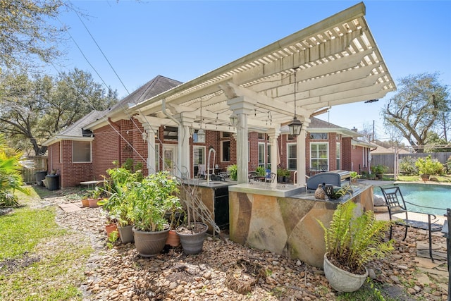 rear view of property featuring a fenced in pool, brick siding, a pergola, and fence