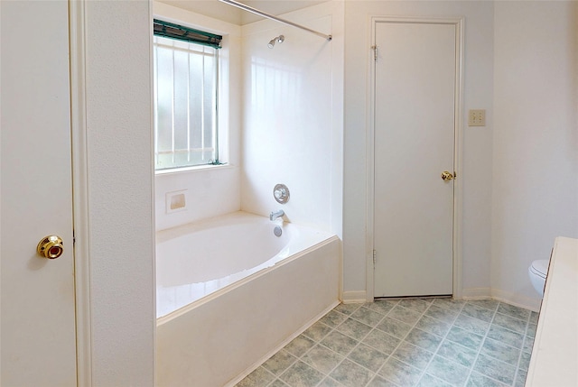 bathroom featuring toilet, a shower, and a tub