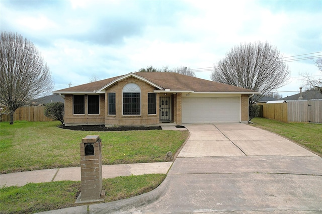 single story home with brick siding, driveway, a garage, and fence