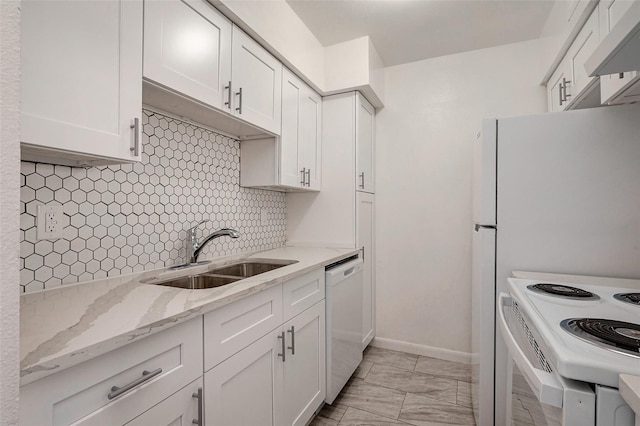 kitchen featuring marble finish floor, a sink, backsplash, white cabinetry, and white appliances