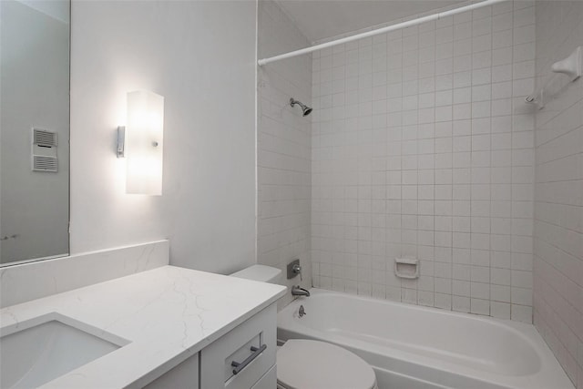 bathroom featuring tub / shower combination, toilet, and vanity