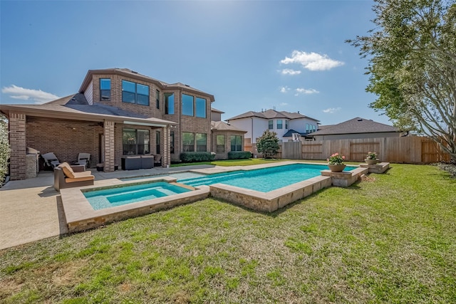 view of swimming pool featuring a fenced backyard, a fenced in pool, a patio, and a yard