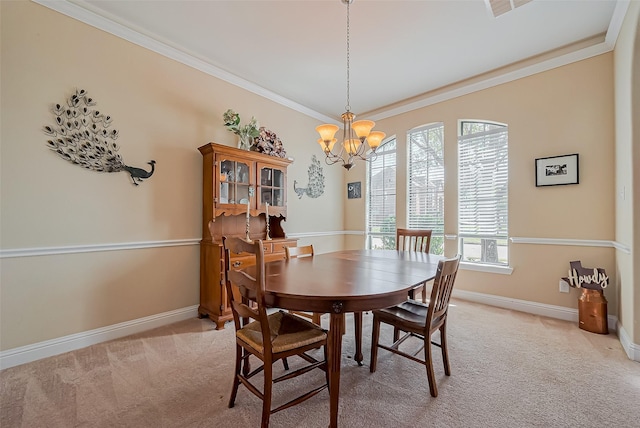 dining room with a notable chandelier, baseboards, light colored carpet, and ornamental molding