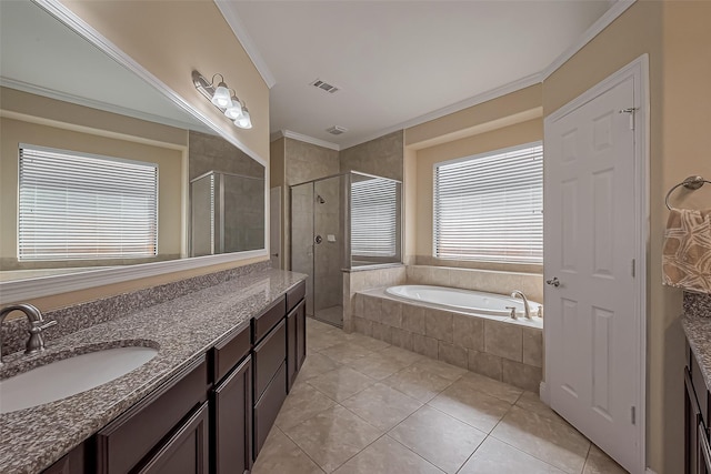 bathroom with vanity, visible vents, a stall shower, a garden tub, and tile patterned floors