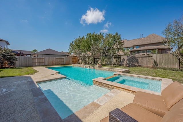 view of pool featuring a patio, a yard, a fenced backyard, and a pool with connected hot tub