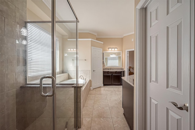 bathroom with tile patterned floors, a shower stall, crown molding, a bath, and vanity