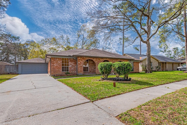 ranch-style house featuring fence, concrete driveway, a front yard, a garage, and brick siding