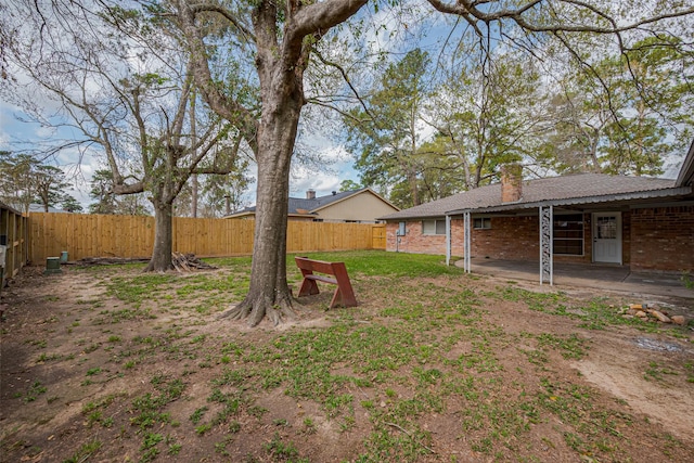 view of yard featuring a patio area and a fenced backyard