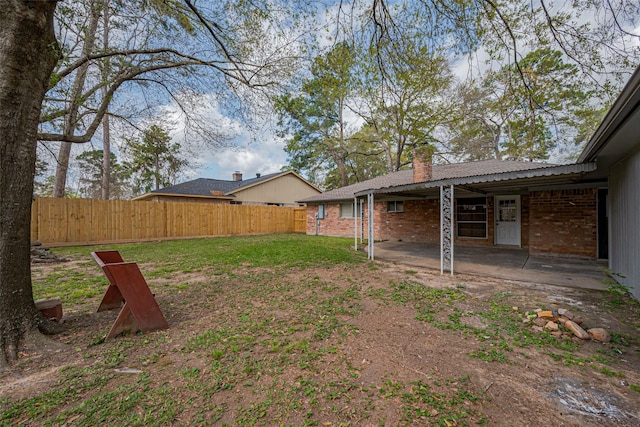 view of yard featuring a patio and fence