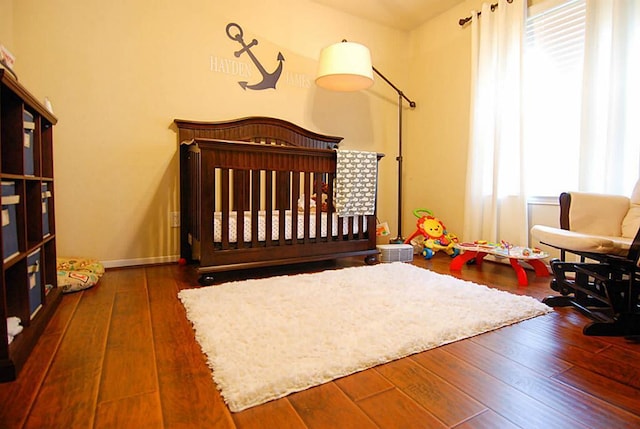 bedroom with hardwood / wood-style flooring