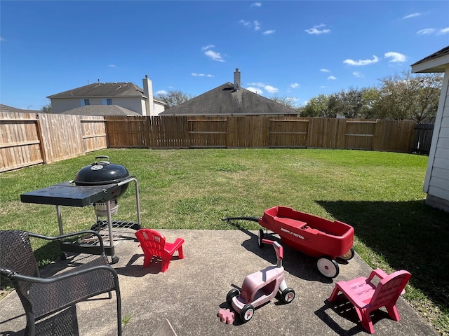 view of yard featuring a patio and a fenced backyard