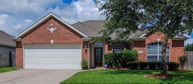 single story home with a front lawn, an attached garage, brick siding, and driveway