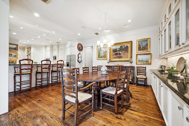 dining area featuring recessed lighting, dark wood-type flooring, and ornamental molding