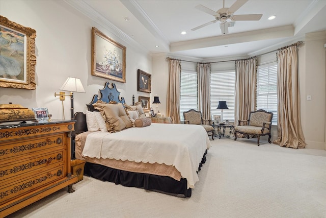 bedroom featuring a tray ceiling, recessed lighting, carpet floors, and ornamental molding