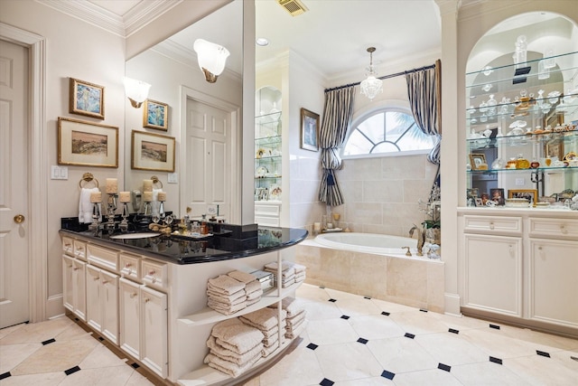 bathroom with vanity, visible vents, ornamental molding, tile patterned flooring, and a garden tub