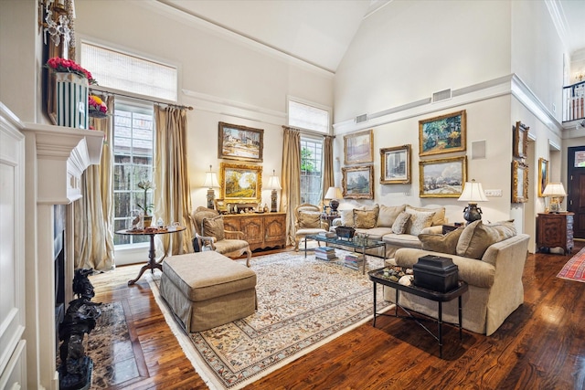 living room with visible vents, high vaulted ceiling, crown molding, and dark wood-style flooring