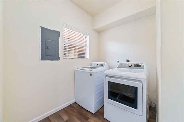 washroom with dark wood-style floors, baseboards, laundry area, electric panel, and washer and dryer