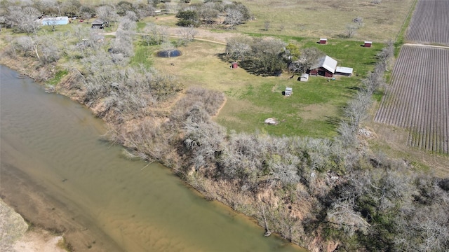 aerial view with a rural view and a water view