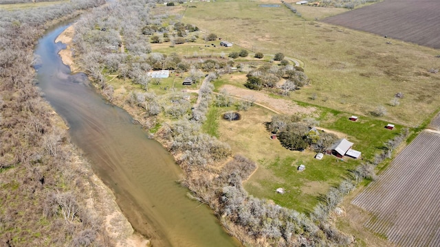 drone / aerial view featuring a rural view and a water view